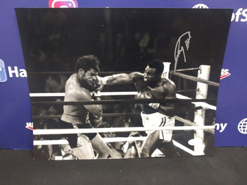 LARRY HOLMES VS LEON SPINKS SIGNED CHAMPIONSHIP 11X14 - JSA COA