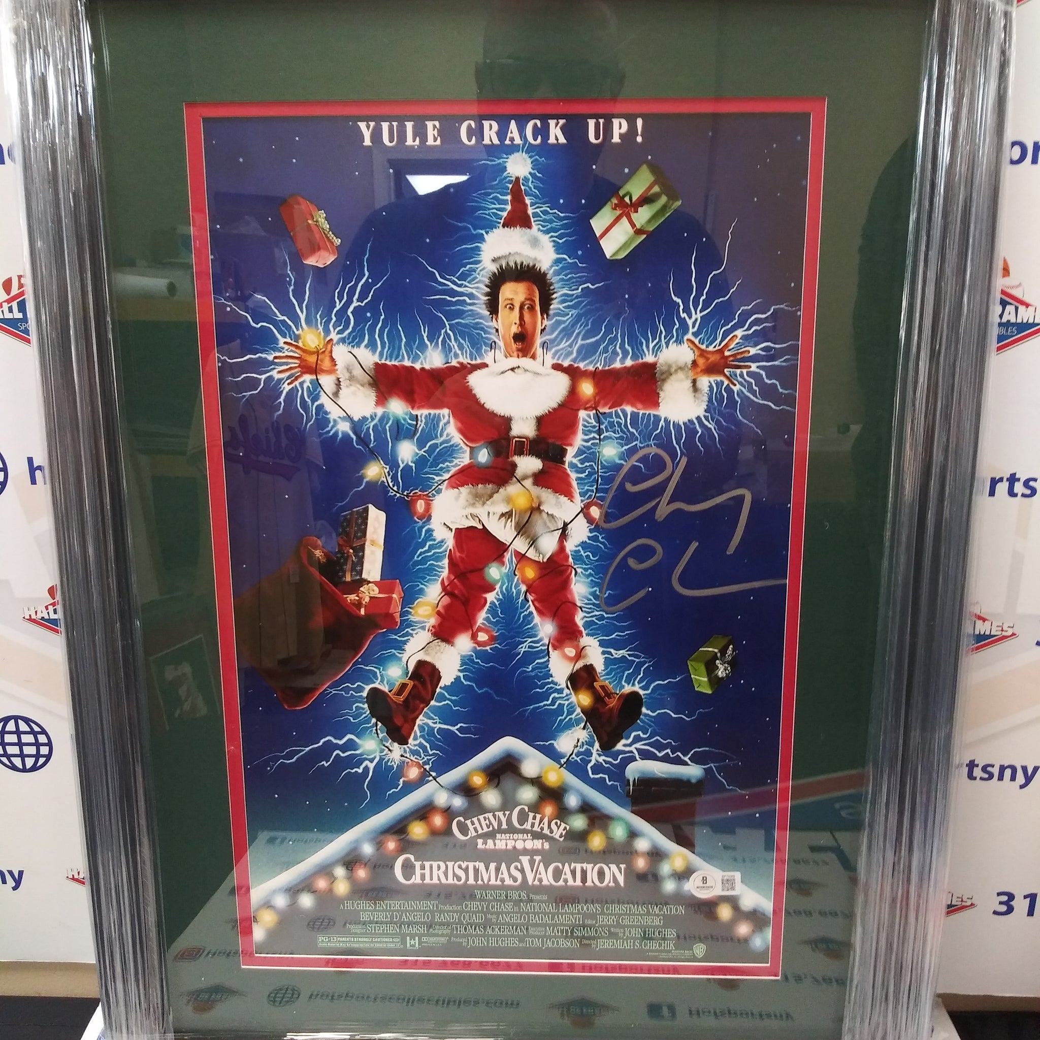CHEVY CHASE SIGNED FRAMED 11X17 CHRISTMAS VACATION MOVIE POSTER - BECKETT COA