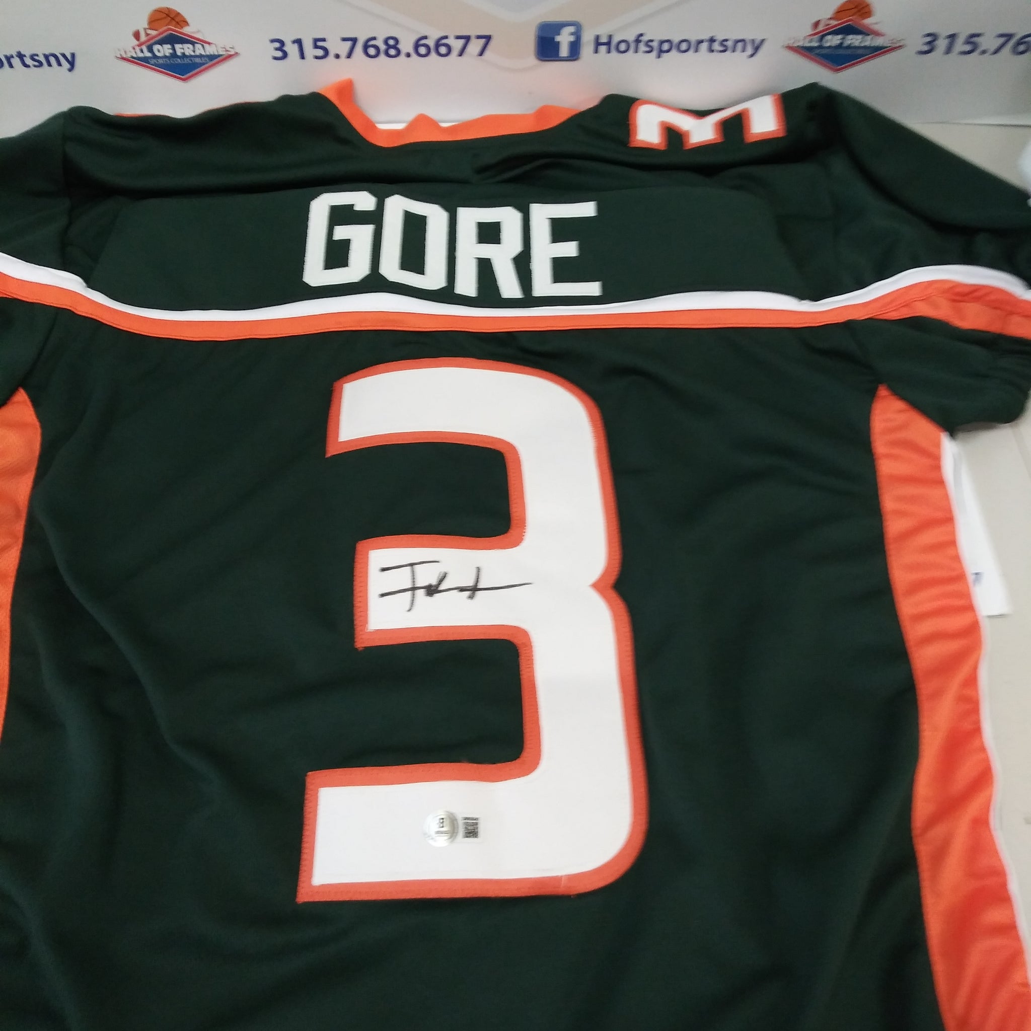FRANK GORE SIGNED MIAMI HURICANES GREEN JERSEY BECKETT COA