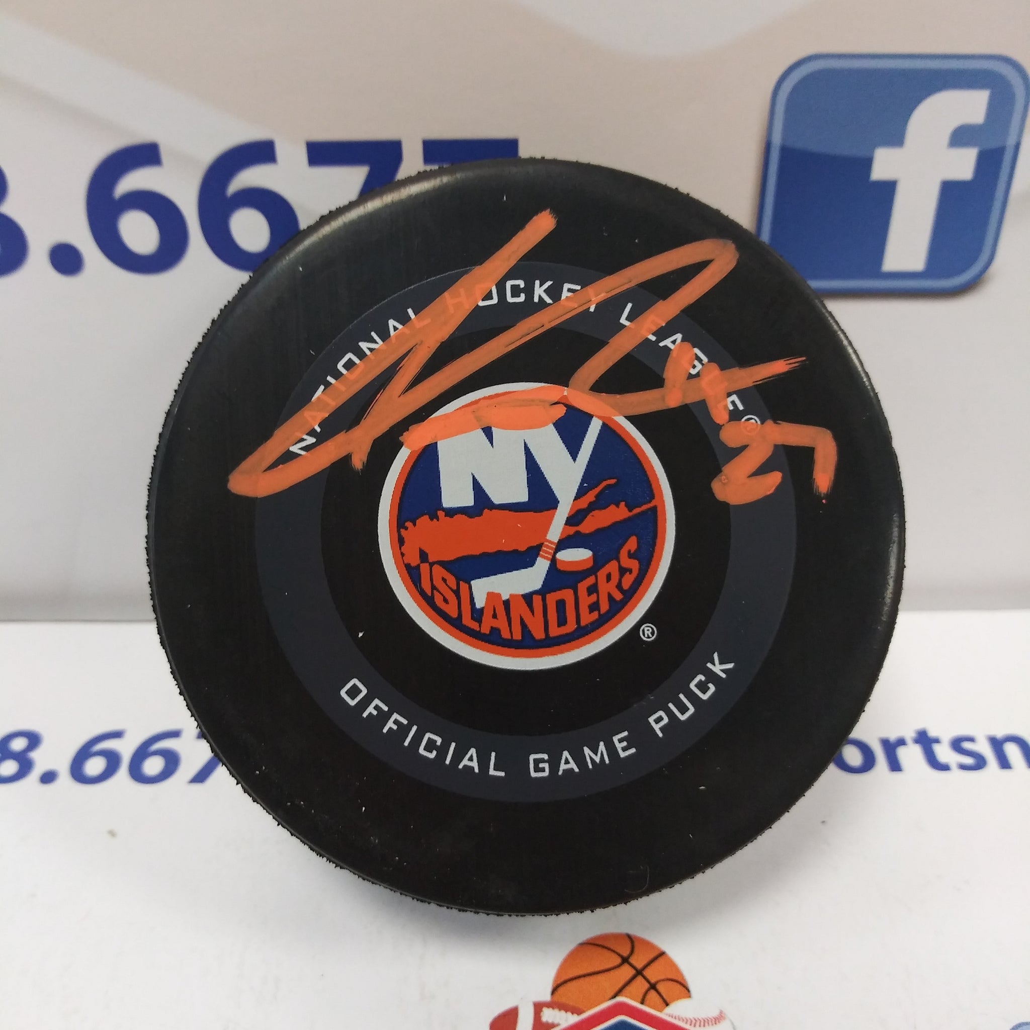 ANDERS LEE NEW YORK ISLANDERS SIGNED OFFICIAL GAME PUCK ORANGE INK BECKETT